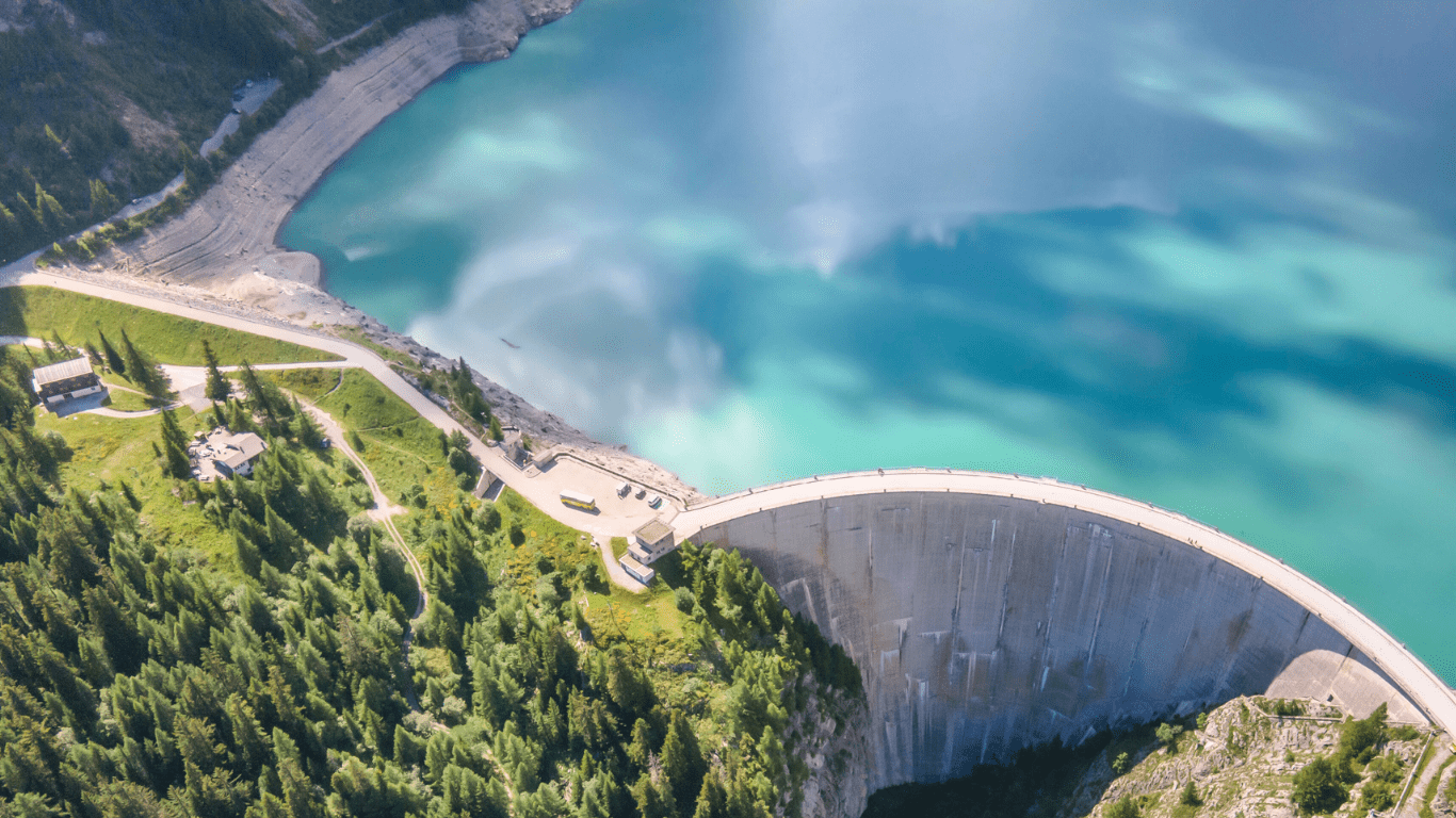 an aerial view of a dam in the middle of a lake