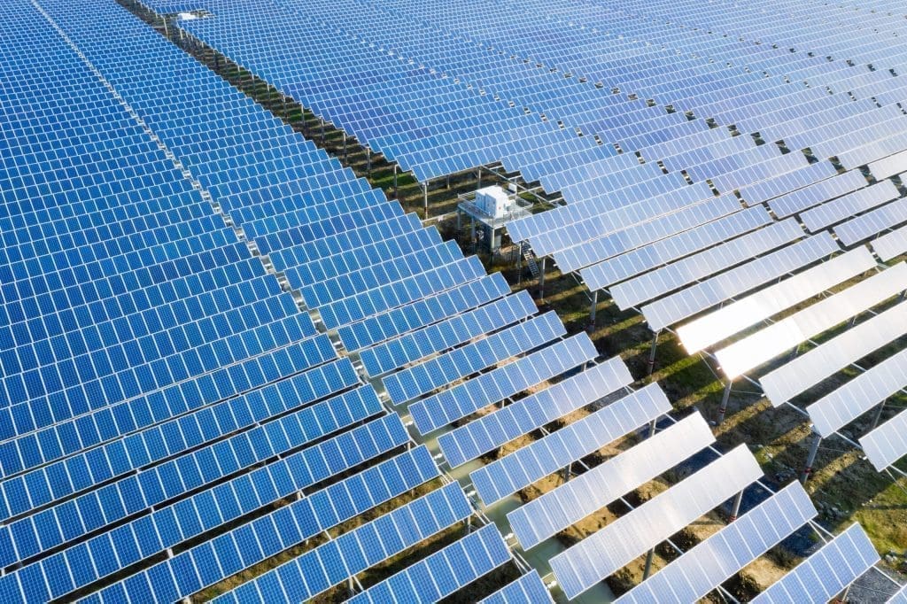 arrays-blue-solar-panels-photovoltaic-power-station-aerial-view-new-energy-scaled-